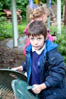 Student enjoying gardening - Palatine Primary School, Worthing
