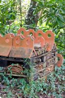 Insect hotel made from terracotta tiles and old broken pots - Pembury House