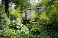The Old Mill with shady border at Gresgarth Hall, Lancashire