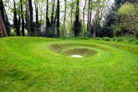 Spiral turf land sculpture at Blakenham Woodland Garden, Suffolk