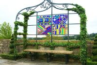 Stained glass by Helen Schell set into metalwork gazebos by Richard Overs with Hedera - Ivy, on the 18th century raised walk. Bourton House, Bourton-on-the-Hill, Moreton-in-Marsh, Glos, UK