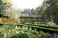Spring garden with parterres filled with Tulips bed at Bed and breakfast de Lievendael in Velp ,Brabant, Holland