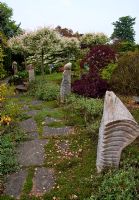 The Sculpture walk lining the Thyme path , Tilford Cottage, Surrey