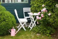 Patio set with Pink Rose and watering can