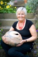 Cherry tree garden owner, June Skinner holds one of her recent ceramic pieces