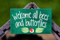 Welcome all bees and butterflies sign. Habitat for encouraging insects into the garden