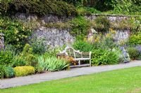 Dartington Hall, Devon. Historic Garden Grade II*. July. Dorothy Elmhirst's Sunny Border with Nepeta, Achillea, Hemerocallis, Agapanthus and Echinops