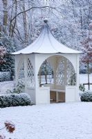 Formal town garden with gazebo covered in snow, Oxford, UK. 