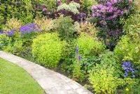 Colourful summer border and garden path