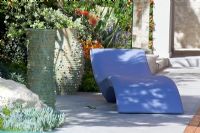 Modern recliner on contemporary garden terrace 