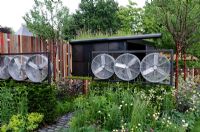 Wind turbines and steel-framed metal structure in the Stockton Drilling Winds of Change Garden, Gold Medal Winner - RHS Chelsea Flower Show 2011