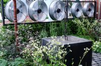 Wind turbines and steel-framed metal structure in the Stockton Drilling Winds of Change Garden, Gold Medal Winner - RHS Chelsea Flower Show 2011 
