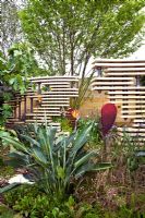 Wooden screen and architectural planting in 'The Bradstone Fusion Garden' - Silver Gilt Medal Winner, RHS Chelsea Flower Show 2011
