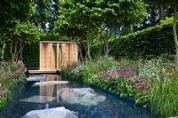 Japanese style pavilion next to pond and Parrotia persica - Persian Ironwood trees, in 'The Laurent-Perrier Garden by Luciano Giubbilei - Nature and Human Intervention' - Gold Medal Winner, RHS Chelsea Flower Show 2011 
