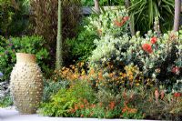Mediterranean style garden with Olea - Olive trees and drought tolerant planting - 'A Monaco Garden' - Gold Medal Winner, RHS Chelsea Flower Show 2011 
