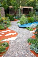 Gravel path through drought tolerant planting and surfaces representing the outback and salt pans in 'The Australian Garden presented by the Royal Botanic Gardens Melbourne' - Gold Medal Winner, RHS Chelsea Flower Show 2011 
