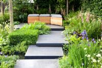 Polished concrete pads form stepping-stones across stream in 'The Lands End Across the Pond Garden' - Gold Medal Winner, RHS Chelsea Flower Show 2011
