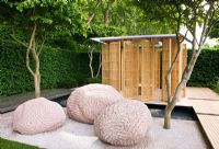 Japanese style carved rocks in gravel beneath Parrotia persica - Persian Ironwood trees - 'The Laurent-Perrier Garden by Luciano Giubbilei - Nature and Human Intervention' - Gold Medal Winner, RHS Chelsea Flower Show 2011 
