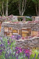 Sculptural drystone walls with built-in insect shelters and Sempervivum - Houseleeks planted on top - The Royal Bank of Canada with the RBC New Wild Garden, Silver Gilt Medal Winner - RHS Chelsea Flower Show 2011 
