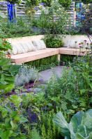 Edible garden surrounded a wooden bench, underplanted with herbs - 'The Deptford Project - An Urban Harvest', Silver Medal Winner, RHS Hampton Court Flower Show 2011