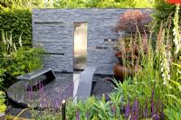 Water feature set into wall. 'The Power of Nature'. Gold medal winner, RHS Chelsea Flower Show 2011