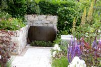 Stone wall and wooden container. 'RNIB Garden', Silver-Gilt Medal Winner. RHS Chelsea Flower Show 2011 