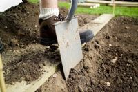 step by step, making a raised bed - digging trench