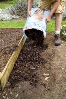 step by step, making a raised bed - adding decorative mulch around outside