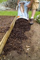 step by step, making a raised bed - adding decorative mulch around outside