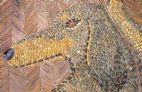 Detail of pebble mosaic at Great Dixter showing head of Christopher Lloyd's Dachshund dog called Canna