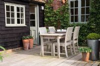 Table set for tea on decked patio 