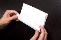 Man rolling napkin 