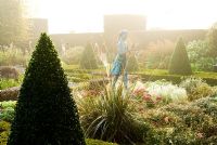 The Formal Garden, with knot garden made of box and berberis, with a statue of a girl holding the lamp of wisdom by Nathan David, and surrounded by tall yew hedges