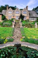 View to house and terraces from Octagonal Pool - High Glanau Manor, Monmouthshire, Wales 
