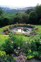 View from terrace to Octagonal pool and landscape beyond - High Glanau Manor, Monmouthshire, Wales 
 