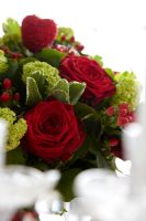 Floral bouquet of Gaultheria 'Shallon Green', Hypericum, Pittosporum, Rosa 'Red Naomi, Rosa 'Merel Van Den Berg' and Viburnum
 