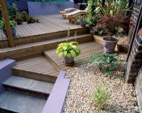 Split level garden with decking and garden furniture 