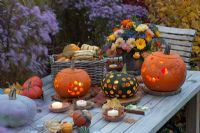 Carved Halloween Pumpkins with arrangement of Calendula, Borago, Dahlia and Rosa