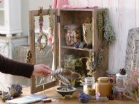 Rustic wooden cabinet with dried herbs - Salvia, Lavandula, Calluna, Laurus, Rosa
