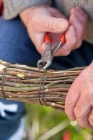 Making a Birch broom -  final wire cutting using pliers.