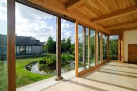 Yoga studio looking out through sliding doors to oriental style garden - Butts Farm, Pond Green, Wicken, Cambridgeshire