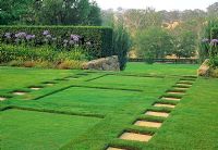 Stepping stone paths on lawn