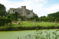 Formal lawns and pond in front of house - Mannington Hall, Norfolk, UK