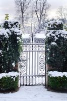 Wrought iron gate with snow in The Fellows' Garden, Clare College, Cambridge