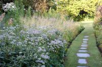 Stepping stone and grass pathway - The Garden House, Buckland Monachorum, Devon 