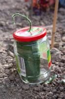 A useful way of keeping gardener's string from getting knotted up is to keep it in a glass jar
