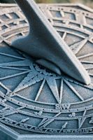 Close up of sundial covered with frost 