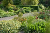 Colourful borders with perennials, grasses and gravel paths