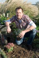 TV celebrity farmer Jimmy Doherty stocking his wildlife garden with plants to attract butterflies, bees and other insects - Jimmy's Farm, Ipswich, Suffolk