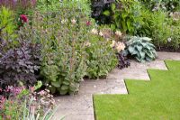 Zig-zag path between lawn and flowerbed 